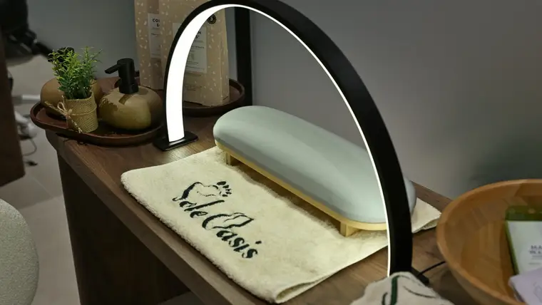 Manicure station with polish wall racks