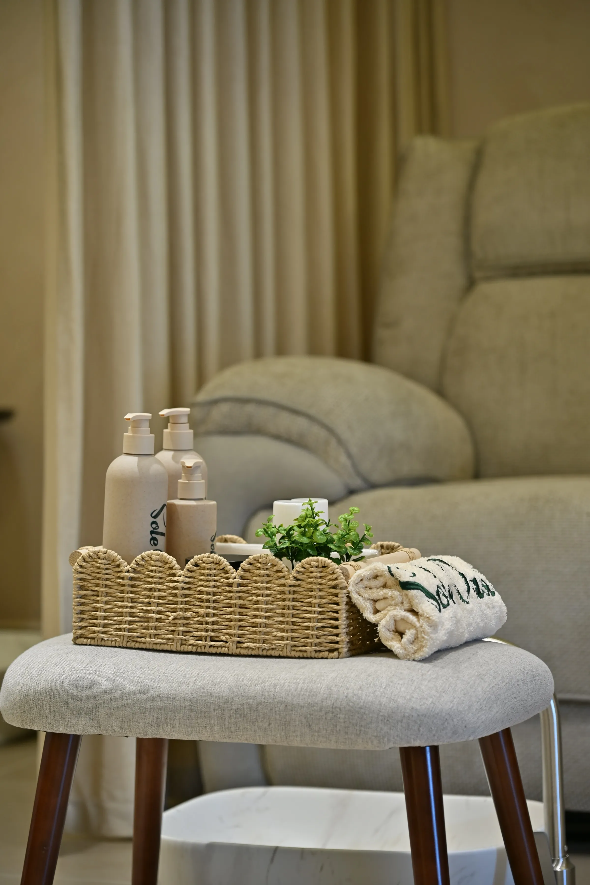 Pedicure recliner and stool in a lit alcove